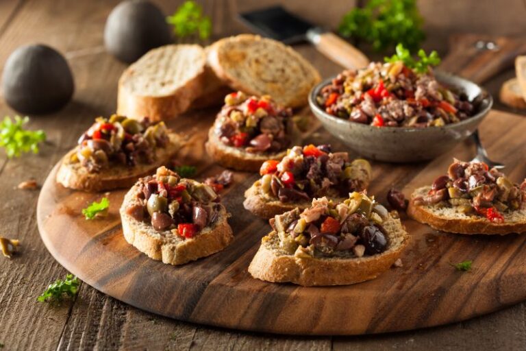 Greek olive bruschetta topped with Kalamata olives, peppers and herbs on toasted bread